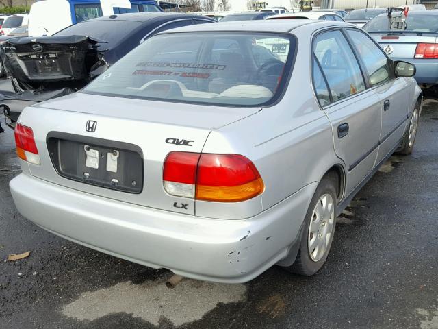 1HGEJ6670WL008697 - 1998 HONDA CIVIC LX SILVER photo 4