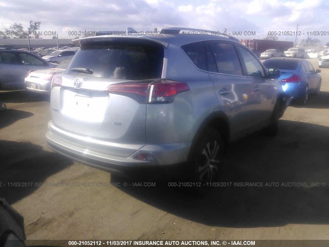 2T3ZFREV9GW244069 - 2016 TOYOTA RAV4 LE SILVER photo 4