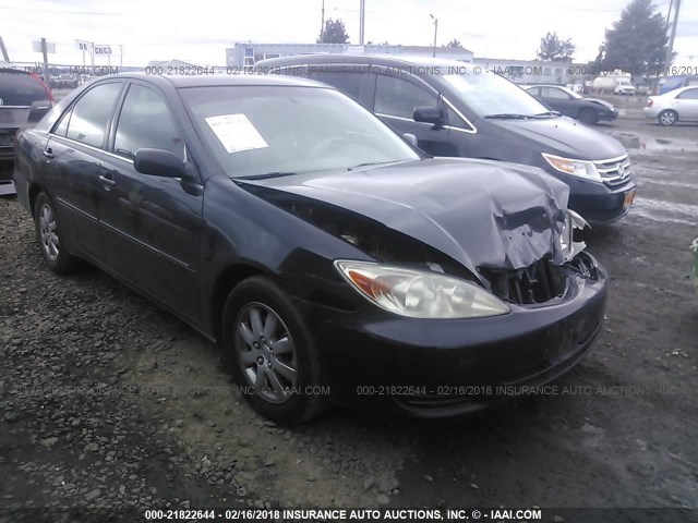 4T1BF30K42U002464 - 2002 TOYOTA CAMRY LE/XLE/SE BLACK photo 1