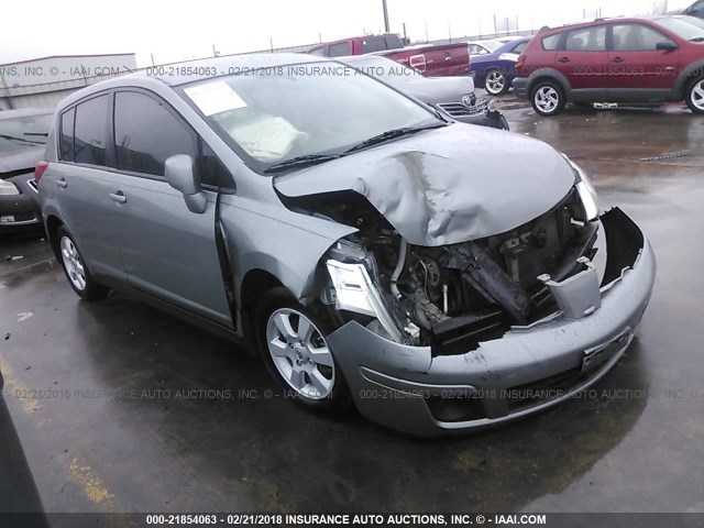 3N1BC13E19L489119 - 2009 NISSAN VERSA S/SL GRAY photo 1