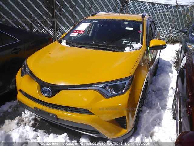 JTMRJREV0HD061219 - 2017 TOYOTA RAV4 HV LE/XLE YELLOW photo 2