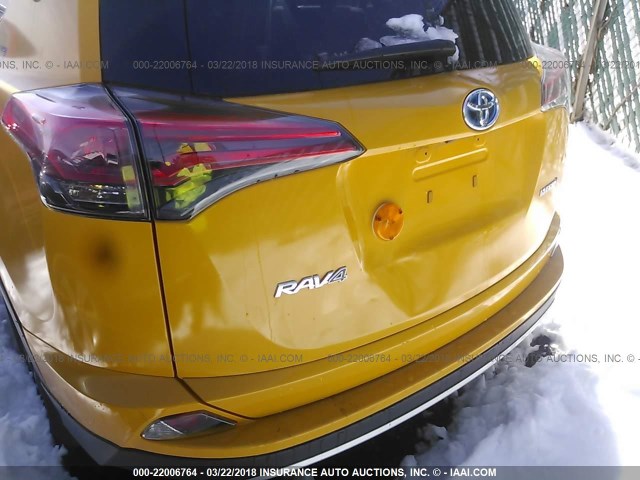 JTMRJREV0HD061219 - 2017 TOYOTA RAV4 HV LE/XLE YELLOW photo 6