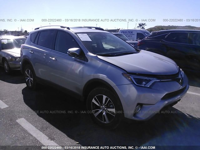 2T3RFREVXJW712561 - 2018 TOYOTA RAV4 ADVENTURE/XLE SILVER photo 1