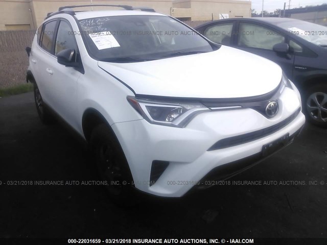 2T3ZFREV6HW323832 - 2017 TOYOTA RAV4 LE WHITE photo 1