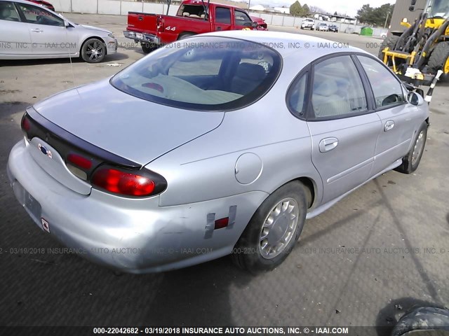 1FAFP53S7XG136374 - 1999 FORD TAURUS SE/COMFORT/SPORT SILVER photo 4