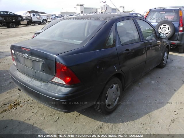 1FAFP33P64W183235 - 2004 FORD FOCUS LX BLUE photo 4