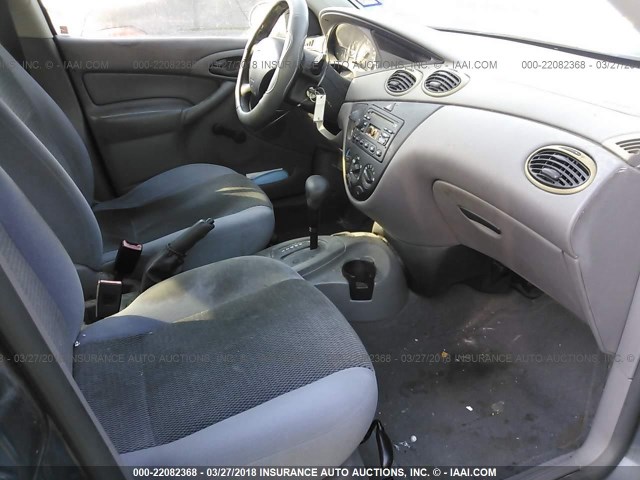 1FAFP33P64W183235 - 2004 FORD FOCUS LX BLUE photo 5