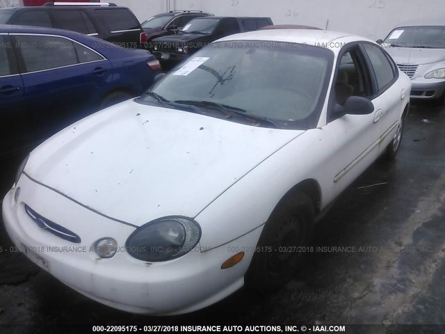 1FAFP52U3XG106677 - 1999 FORD TAURUS LX WHITE photo 2