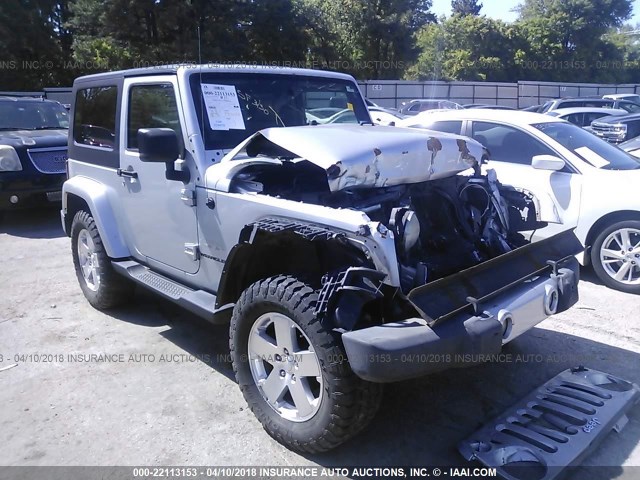 1J4FA54159L719550 - 2009 JEEP WRANGLER SAHARA SILVER photo 1