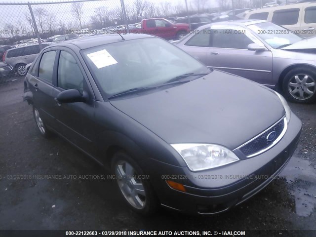 1FAFP34N05W283152 - 2005 FORD FOCUS ZX4 GRAY photo 1