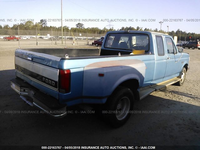 1FTJX35M0PKA78533 - 1993 FORD F350 BLUE photo 4