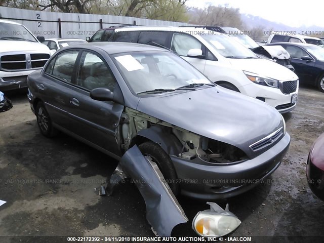 KNADC123826100026 - 2002 KIA RIO GRAY photo 1