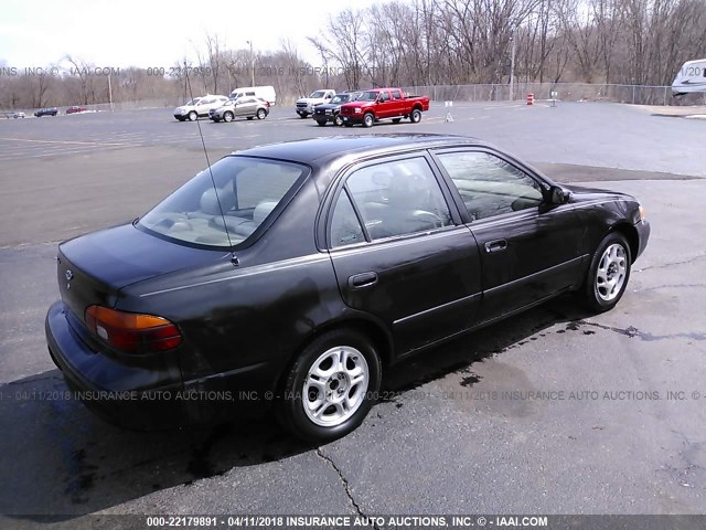 1Y1SK5481WZ415652 - 1998 CHEVROLET GEO PRIZM LSI BLACK photo 4