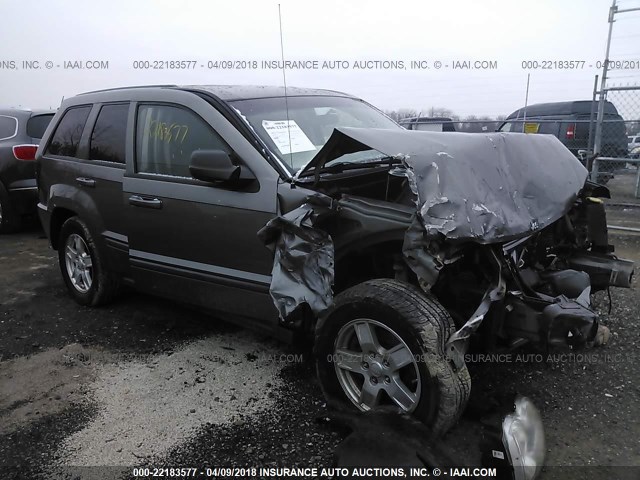 1J8GR48K77C674973 - 2007 JEEP GRAND CHEROKEE LAREDO/COLUMBIA/FREEDOM GRAY photo 1