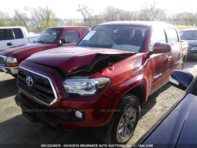 3TMDZ5BN4GM004640 - 2016 TOYOTA TACOMA DBL CAB/SR5/TRD SPORT/OR RED photo 2