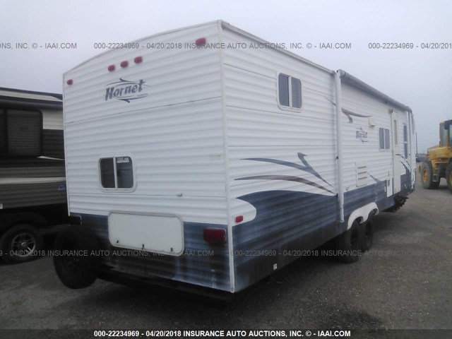 4YDT30B216E322948 - 2006 KEYSTONE HORNET BLUE photo 4