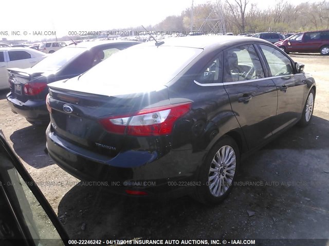 1FAHP3J22CL277466 - 2012 FORD FOCUS TITANIUM BLACK photo 4