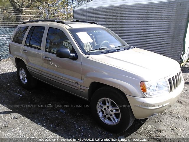 1J4GW58S3YC264558 - 2000 JEEP GRAND CHEROKEE LIMITED GOLD photo 1