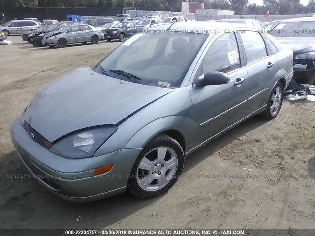 1FAFP343X3W150104 - 2003 FORD FOCUS SE COMFORT/SE SPORT GREEN photo 2