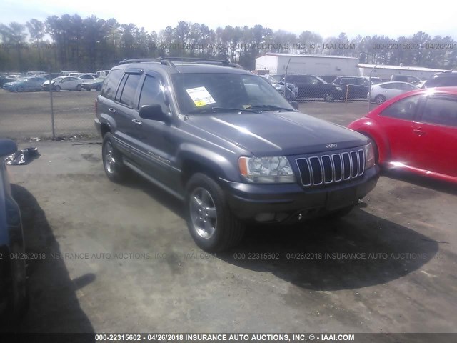 1J8GW68J42C106216 - 2002 JEEP GRAND CHEROKEE OVERLAND GRAY photo 1