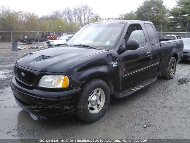 1FTRX17W2XNB42981 - 1999 FORD F150 BLACK photo 2