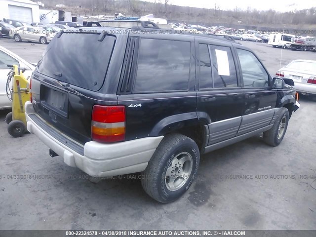 1J4GZ58S1VC689392 - 1997 JEEP GRAND CHEROKEE LAREDO/TSI BLACK photo 4