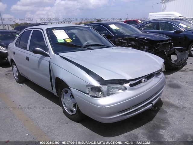 1NXBR12E3YZ305621 - 2000 TOYOTA COROLLA VE/CE/LE SILVER photo 1