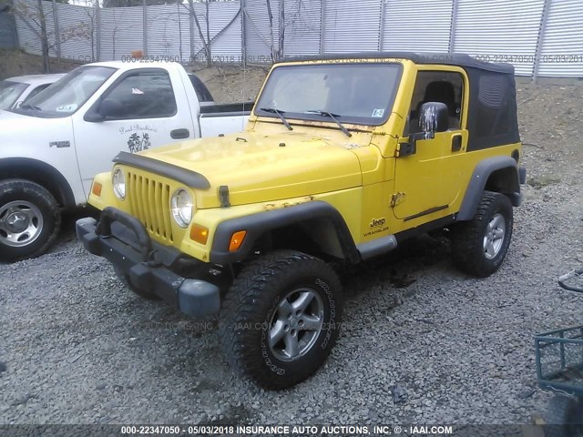 1J4FA29154P704765 - 2004 JEEP WRANGLER / TJ SE YELLOW photo 2