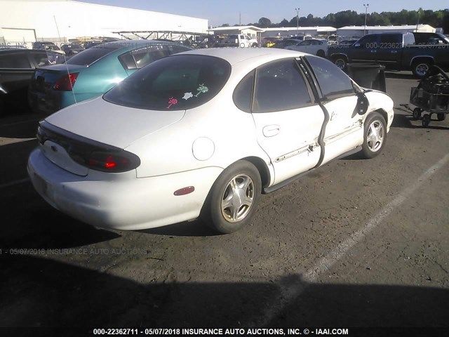 1FAFP52U6XA314975 - 1999 FORD TAURUS LX WHITE photo 4