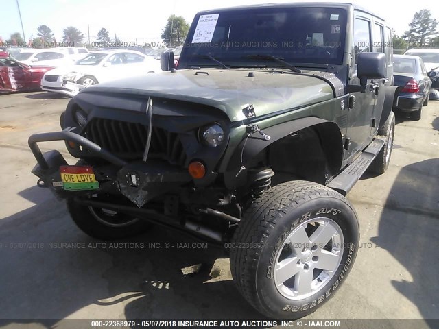 1J4GA59138L617854 - 2008 JEEP WRANGLER UNLIMITE SAHARA GREEN photo 6