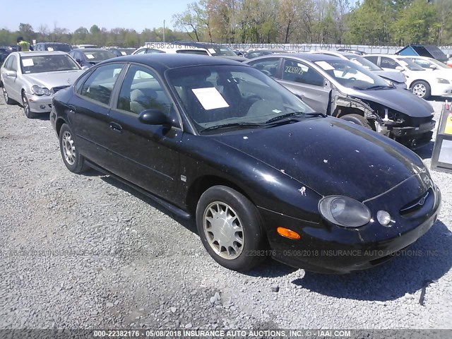 1FAFP53S7XG276828 - 1999 FORD TAURUS SE/COMFORT/SPORT BLACK photo 1