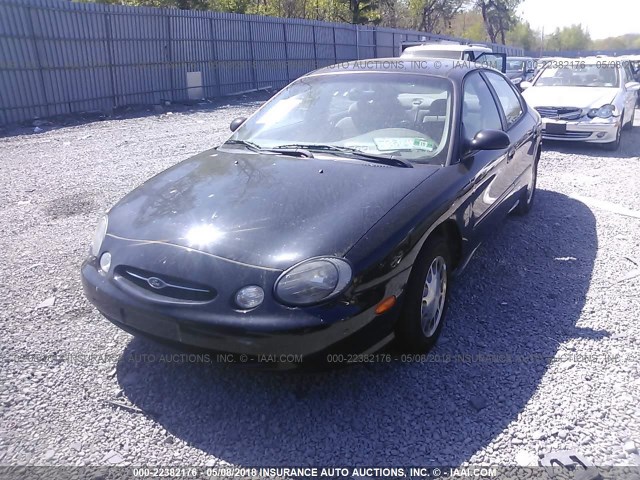 1FAFP53S7XG276828 - 1999 FORD TAURUS SE/COMFORT/SPORT BLACK photo 2