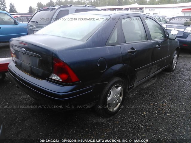 1FAFP33P34W197657 - 2004 FORD FOCUS LX BLUE photo 4