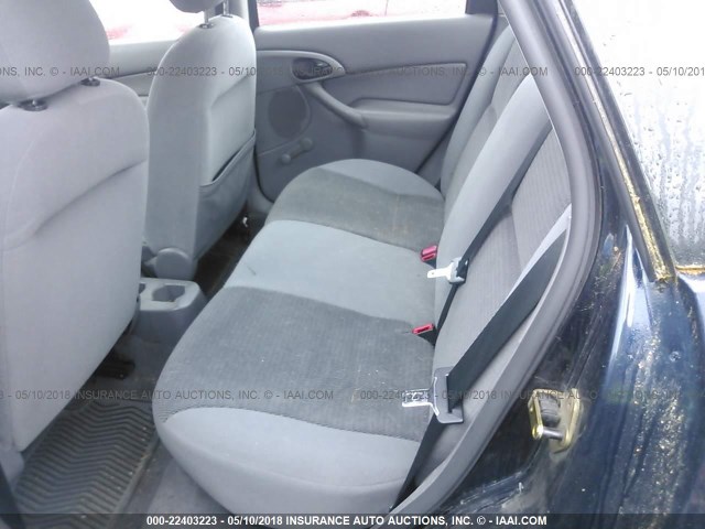 1FAFP33P34W197657 - 2004 FORD FOCUS LX BLUE photo 8