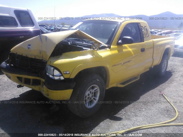 1B7GG22YXXS290044 - 1999 DODGE DAKOTA YELLOW photo 2