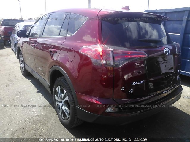 JTMZFREV1JD112590 - 2018 TOYOTA RAV4 LE RED photo 3