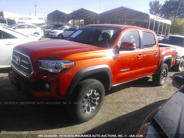 3TMCZ5AN3GM007705 - 2016 TOYOTA TACOMA DBL CAB/SR/SR5/TRD SPT/OR ORANGE photo 2