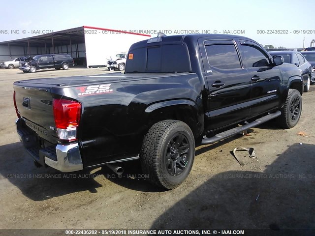 5TFCZ5AN3GX010985 - 2016 TOYOTA TACOMA DBL CAB/SR/SR5/TRD SPT/OR BLACK photo 4
