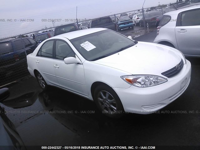 JTDBE30K940282061 - 2004 TOYOTA CAMRY LE/XLE WHITE photo 1
