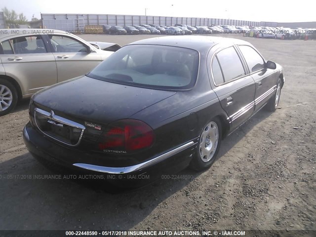 1LNHM97V7XY690138 - 1999 LINCOLN CONTINENTAL  BLACK photo 4