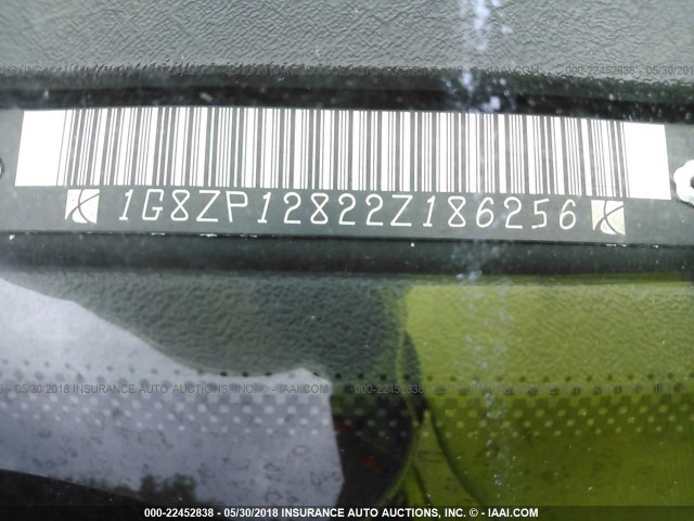 1G8ZP12822Z186256 - 2002 SATURN SC1 SILVER photo 9