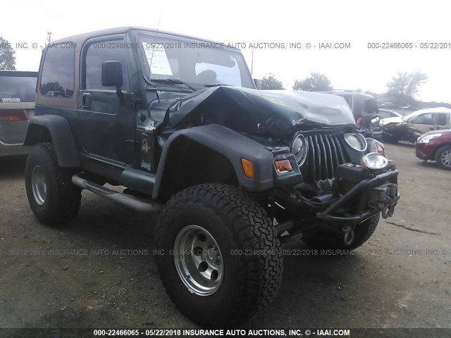 1J4FA59S6YP768782 - 2000 JEEP WRANGLER / TJ SAHARA GREEN photo 1