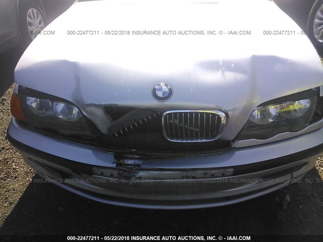 WBAAM5346YKG18122 - 2000 BMW 328 I SILVER photo 6