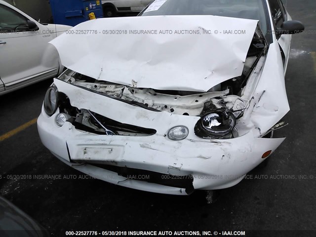 1FAFP52U6XG321339 - 1999 FORD TAURUS LX WHITE photo 6