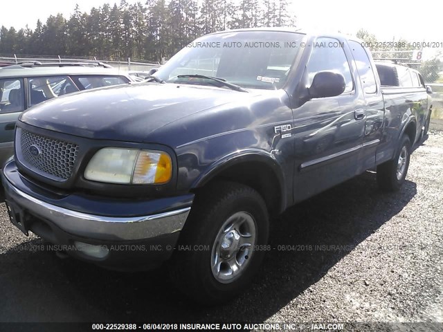 1FTRX18L6XKB32279 - 1999 FORD F150 ლურჯი ფოტო 2