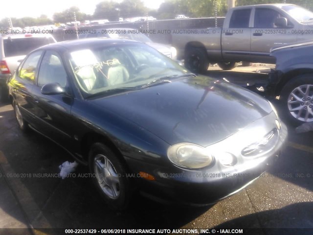 1FAFP53S2XG147153 - 1999 FORD TAURUS SE/COMFORT/SPORT Dark Blue photo 1