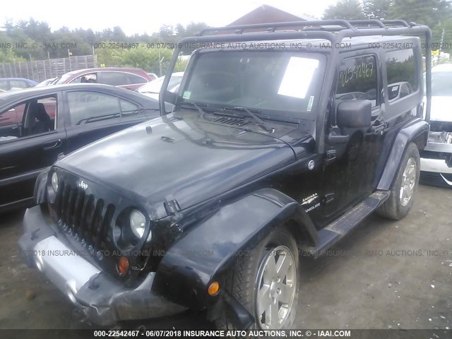 1J8FA541X9L755104 - 2009 JEEP WRANGLER SAHARA BLACK photo 2