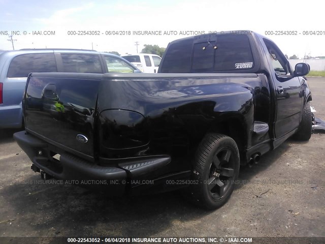 2FTZF07302CA86279 - 2002 FORD F150 SVT LIGHTNING BLACK photo 4