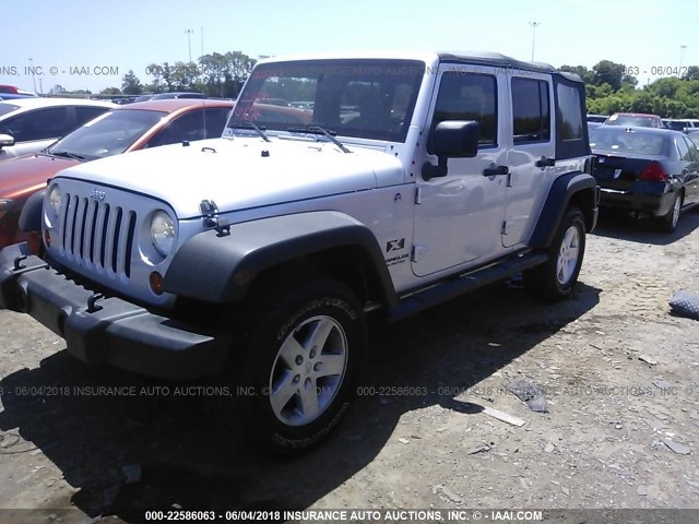 1J4GA39139L772880 - 2009 JEEP WRANGLER UNLIMITE X SILVER photo 2