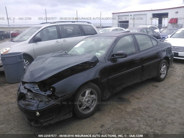 1G2NV52EX2M572996 - 2002 PONTIAC GRAND AM GT1 BLACK photo 2